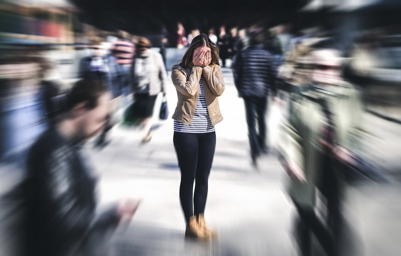 freaked out woman in the middle of a blurred image