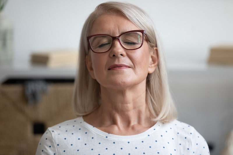 woman with her eyes closed looking peaceful