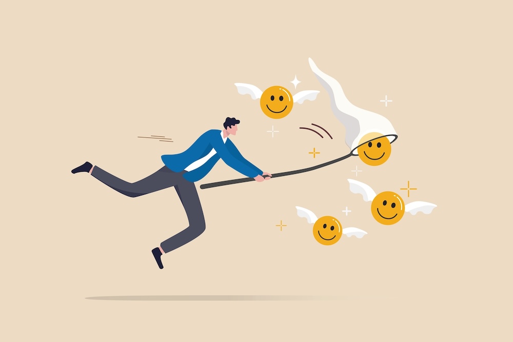 Illustration of man chasing winged smiley faces with a net